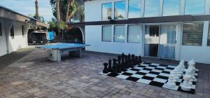 Luxury Villa, with bonus pool house, Private Pool, Hot tub, rock water fall and slide, putting green, basketball, shuffle board, play gym, privately gated on circular driveway.