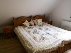 a bed with a quilt on it with pillows at nour hotel in Dubai