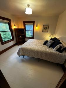 a bedroom with a bed with two pillows on it at The Edison, Historic Centralia in Centralia