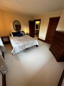 a bedroom with a bed and a dresser at The Edison, Historic Centralia in Centralia +18 photos