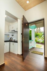 an open door to a kitchen in a house at D7 La Serene in Benaulim