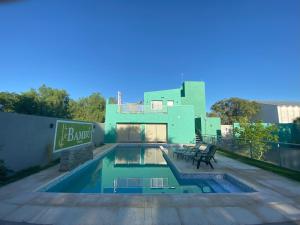 a swimming pool on the roof of a house at Bambú Hotel in Chepes