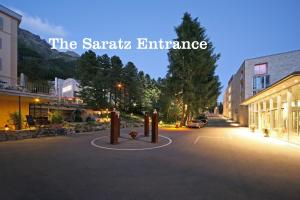 a street with a sign that reads the santatal entrance at Hotel Saratz Pontresina in Pontresina