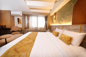 Postel nebo postele na pokoji v ubytování Daali Hotel & Apartment