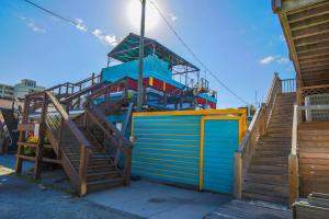 a set of stairs leading up to a roller coaster at Shangri-La in Folly Beach