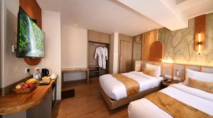 Postel nebo postele na pokoji v ubytování Daali Hotel & Apartment