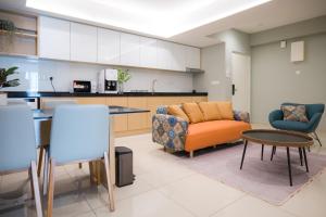 a living room with a couch and a table at Zenstay Abnb Perai Penang in Bukit Mertajam +78 photos