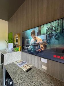 TV a/nebo společenská místnost v ubytování Italy Condotel Darasa
