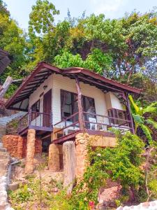 a small house on top of a hill at Phi Phi Private Beach Resort in Phi Phi Islands