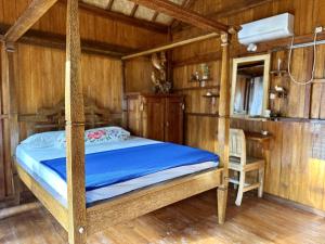 Postel nebo postele na pokoji v ubytování Kura Kura Beach