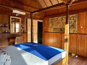 Postel nebo postele na pokoji v ubytování Kura Kura Beach