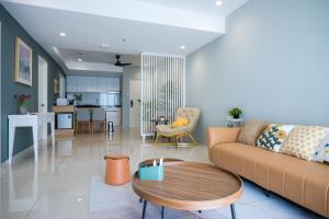 a living room with a couch and a table at Zenstay Abnb Perai Penang in Bukit Mertajam