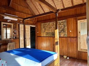 Postel nebo postele na pokoji v ubytování Kura Kura Beach