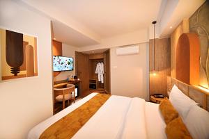 Postel nebo postele na pokoji v ubytování Daali Hotel & Apartment