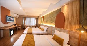 TV a/nebo společenská místnost v ubytování Daali Hotel & Apartment