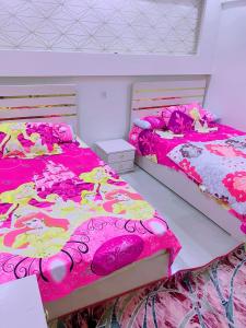 Postel nebo postele na pokoji v ubytování Mini VELLA ALJWHARA + 6 fotografií