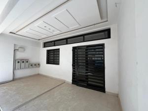 a large white room with a large black door at Keeluxe Cite Keur Gorgui- Superbe appartement in Dakar
