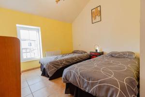 Postel nebo postele na pokoji v ubytování Charmante maison au calme Royan