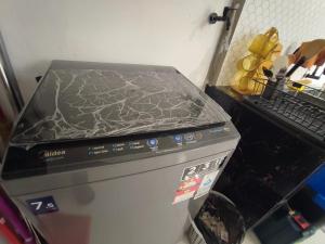 a stove top oven with a cover on top of it at Hermoso Homestay Kota Bharu in Kota Bharu