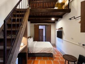 Postel nebo postele na pokoji v ubytování 金門悠哉悠古厝民宿 Yozaiyo39 B&B