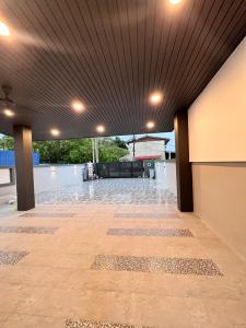 a large empty room with a ceiling with lights at [9 TO 11 PAX] MUAR JERAM - BRIGHT INN HOMESTAY in Muar
