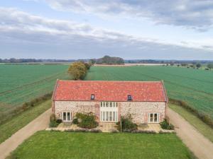 an aerial view of a house with a red roof at 2 Bed in Pensthorpe KT002 in Kettlestone