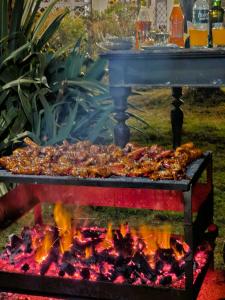 a grill with some food on top at Rani Kothi Heritage Residency in Darjeeling