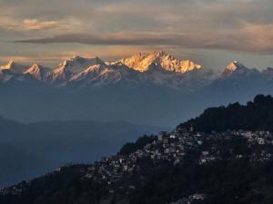 a view of a mountain with snow capped mountains at Rani Kothi Heritage Residency in Darjeeling