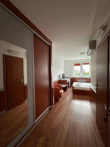 Postel nebo postele na pokoji v ubytování HOTEL ZELENÝ DVOR