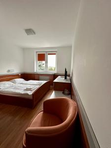 Postel nebo postele na pokoji v ubytování HOTEL ZELENÝ DVOR