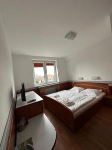 Postel nebo postele na pokoji v ubytování HOTEL ZELENÝ DVOR
