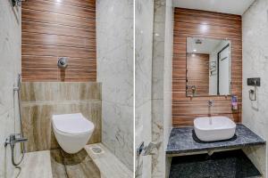 łazienka z toaletą i umywalką w obiekcie FabHotel Grand Inn I w mieście Navi Mumbai