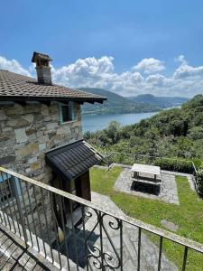 a balcony of a house with a picnic table at Into the wild in Oira