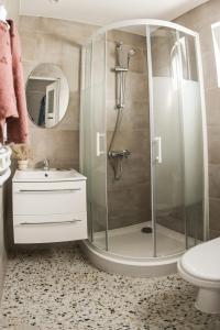 a bathroom with a shower and a sink at Keba in Władysławowo +92 photos