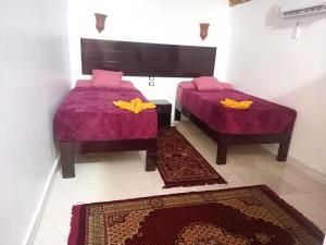 Voodi või voodid majutusasutuse Ajwa Guest House toas