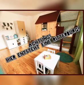 an image of a kitchen and a living room at Familien-Apartment SchmitTs Katz 