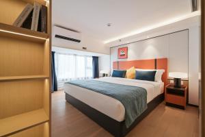 Postel nebo postele na pokoji v ubytování Livetour Hotel HaiZhu YiJing Road Metro Guangzhou