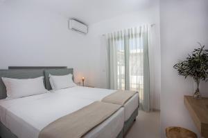 Postel nebo postele na pokoji v ubytování Onar Villas Skyros + 37 fotografií