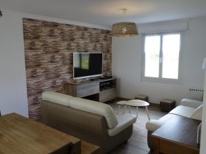TV a/nebo společenská místnost v ubytování Maison de la Presqu'île - 4 chambres avec Vue Mer