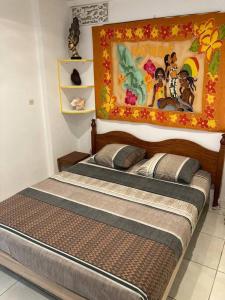 Postel nebo postele na pokoji v ubytování APPARTEMENT COSY TERRASSE VUE MER - TROIS ÎLETS