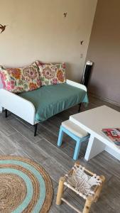 a living room with a couch and a table at Maison de village Azillanet in Azillanet