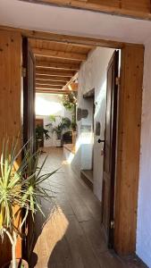 a hallway with an open door to a house at Casas cuevas, Los Cabucos in Agaete