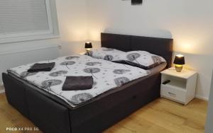 Postel nebo postele na pokoji v ubytování APARTMÁN KRISTÝNA