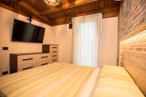 Un ou plusieurs lits dans un hébergement de l'établissement Appartamento da Marco e Kaila