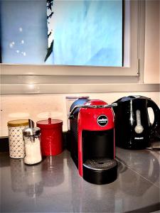 a red toaster sitting on top of a kitchen counter at Da Carlin in Cesena