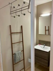a bathroom with a shower and a sink at chez Gérald in Noumea
