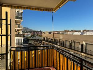 a balcony with a view of a city at Nina's crib 2BR flat in Boliches in Fuengirola