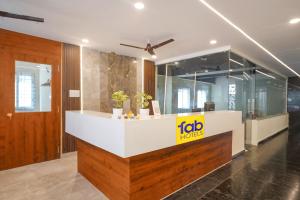 an office lobby with a reception counter with a job horizons sign at FabHotel Air Live - Nr Ameerpet metro station in Hyderabad