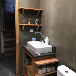 a bathroom with a sink and a toilet at WAKA PICO AZORES in São Roque do Pico