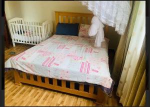 Cama o camas de una habitación en Katabi Apartment Entebbe